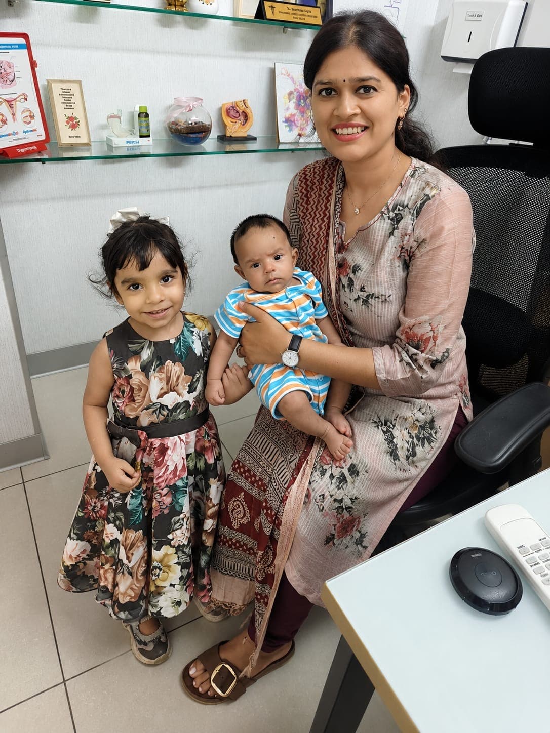 Warm moment with a mother and children during a clinic visit